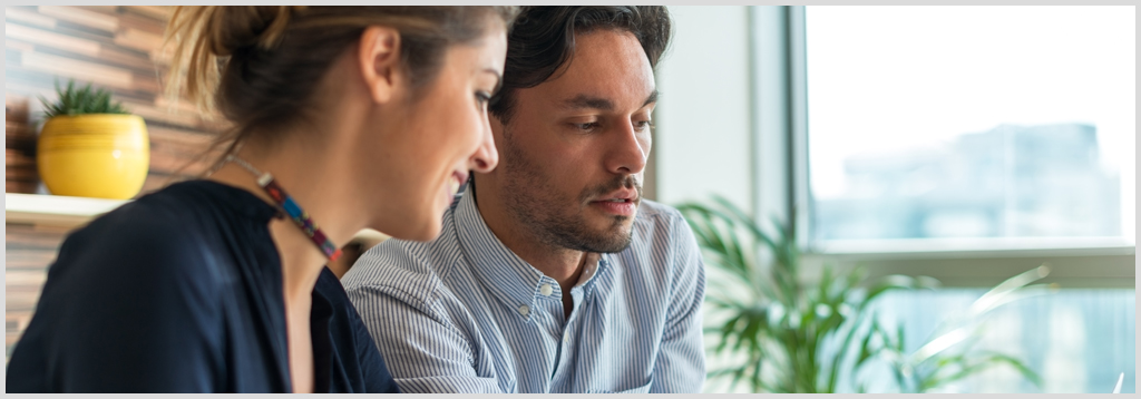 Photo of male and female collaborating