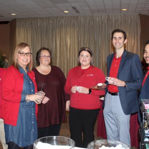 Group of Cardinal employees conversing amicably