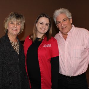 Employees Kim Rowan and Judy Pavlich with member